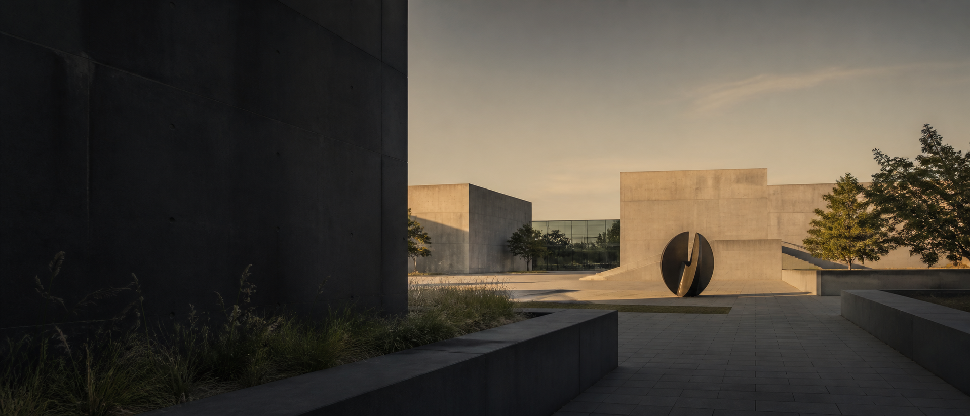 Contemporary concrete cultural building and quiet plaza at late afternoon